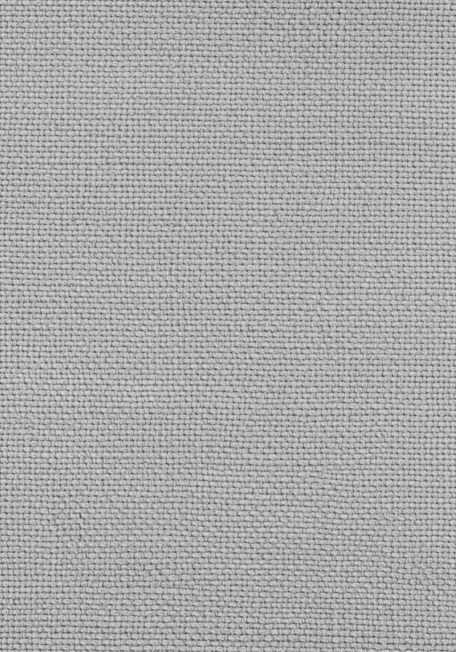 Vue macro d'un tissu hypoallergénique, montrant un tissage extrêmement serré et lisse qui empêche le passage des acariens.