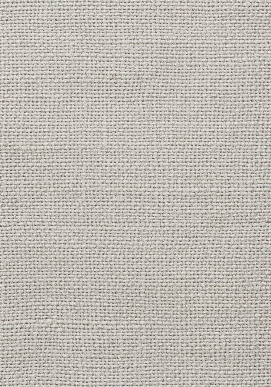 Une photo macro de la texture d'un tissu en lin lavé, montrant le détail et l'irrégularité des fibres.